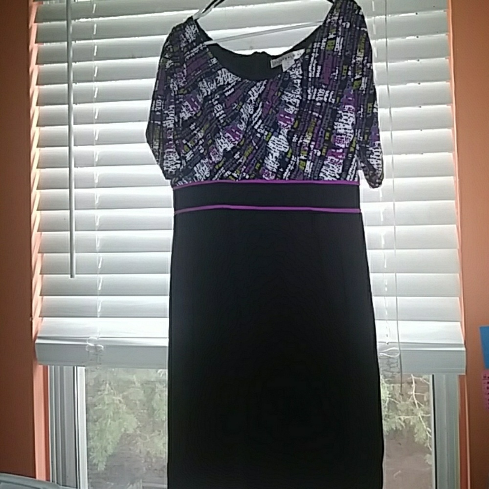 Black dress with multicolored top.